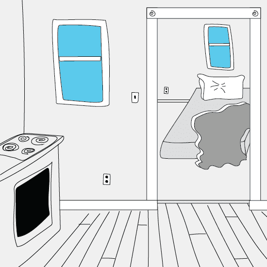 the kitchen of someone's apartment, with a doorway looking into a bedroom